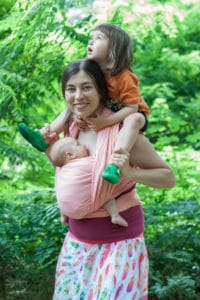 babywearing consultant Anna wearing her children