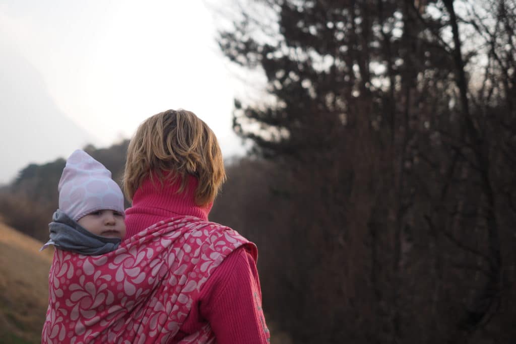 babywearing mama from behind with baby in a Ruck in Sveja babywrap