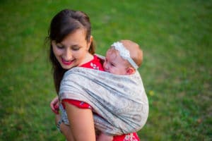 babywearing mama with baby on her back