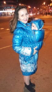 babywearing mama with babywearing coat from Diva Milano