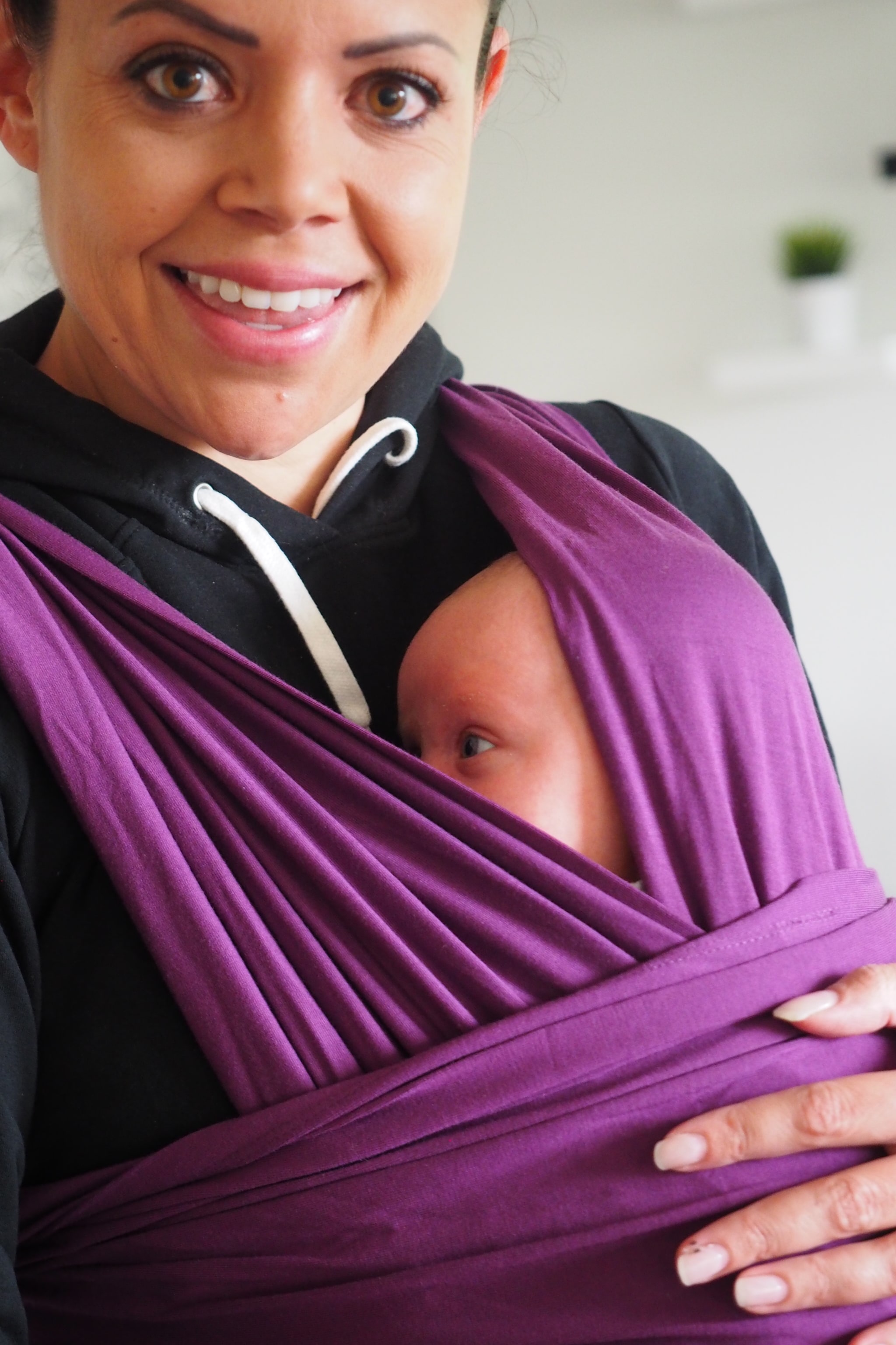 Mom with baby in a stretchy wrap