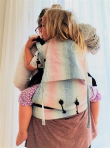 Mama wearing toddler on her back with BuzziTai
